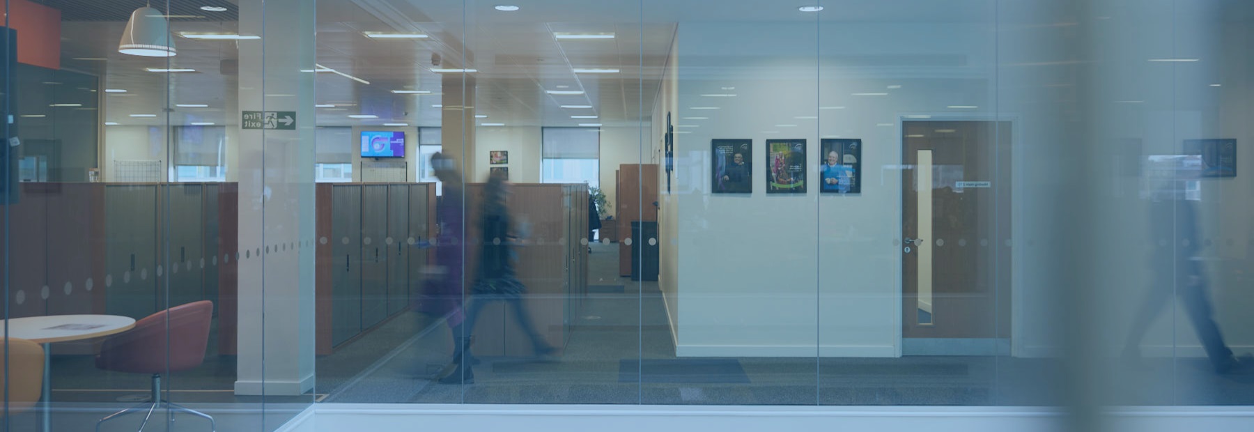 Blurred image of office hallway and glass walls