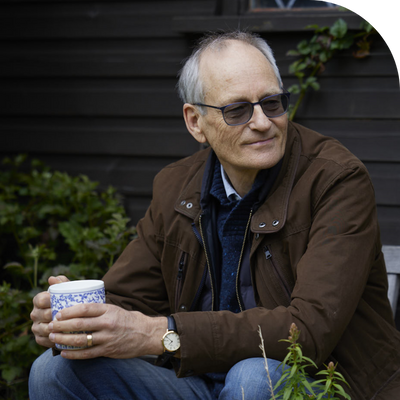 PPF member sat with a cup of tea in the garden