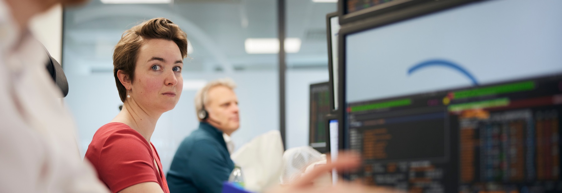 PPF colleagues sat at desks using monitors
