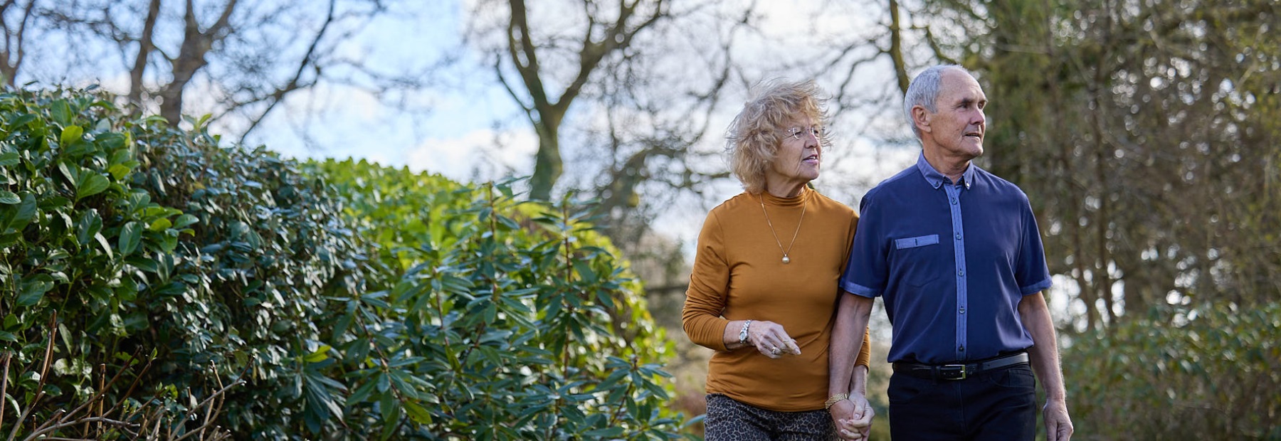 PPF member and her husband walking in their garden