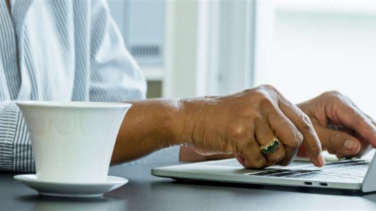 Person typing on laptop