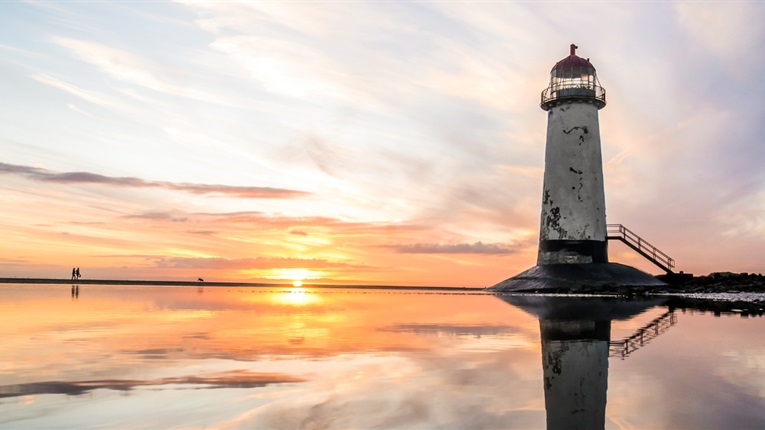Image of a lighthouse at sunset.