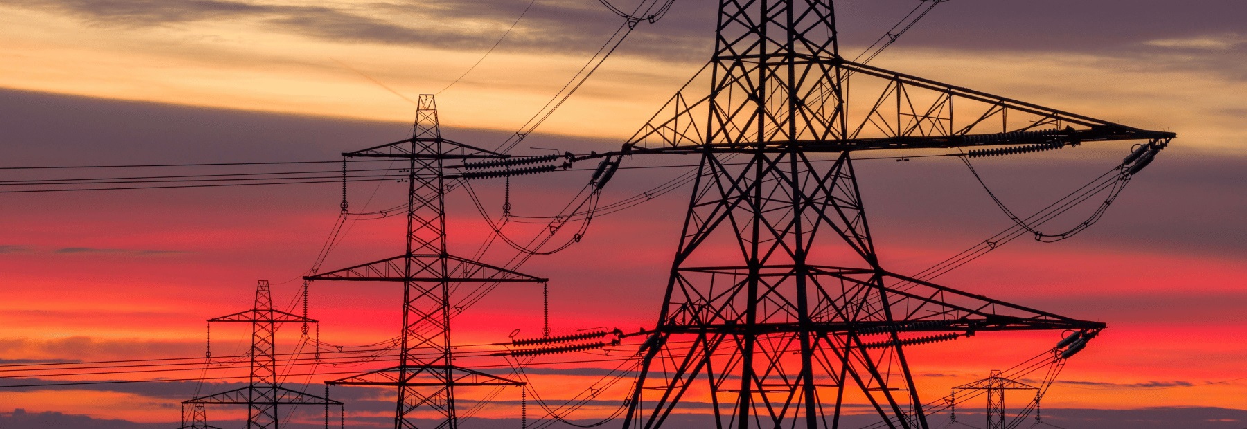 Transmission towers at sunset