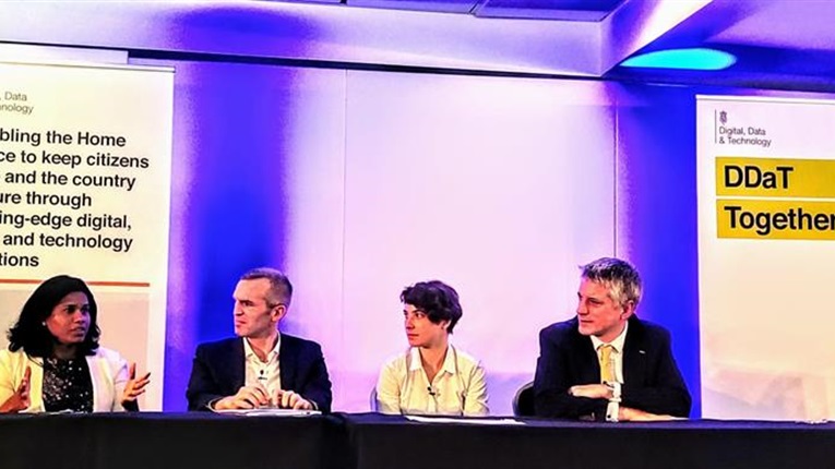 A panel of four people in discussion